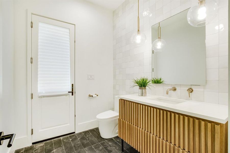 Powder bath with door to backyard pool area