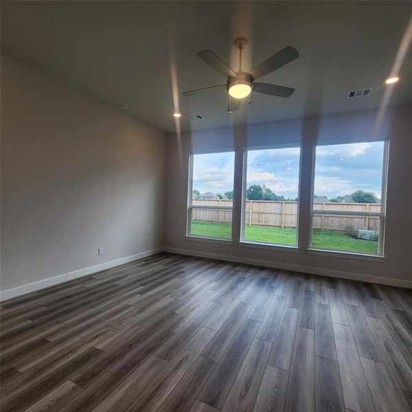 three large standing window in master bed room