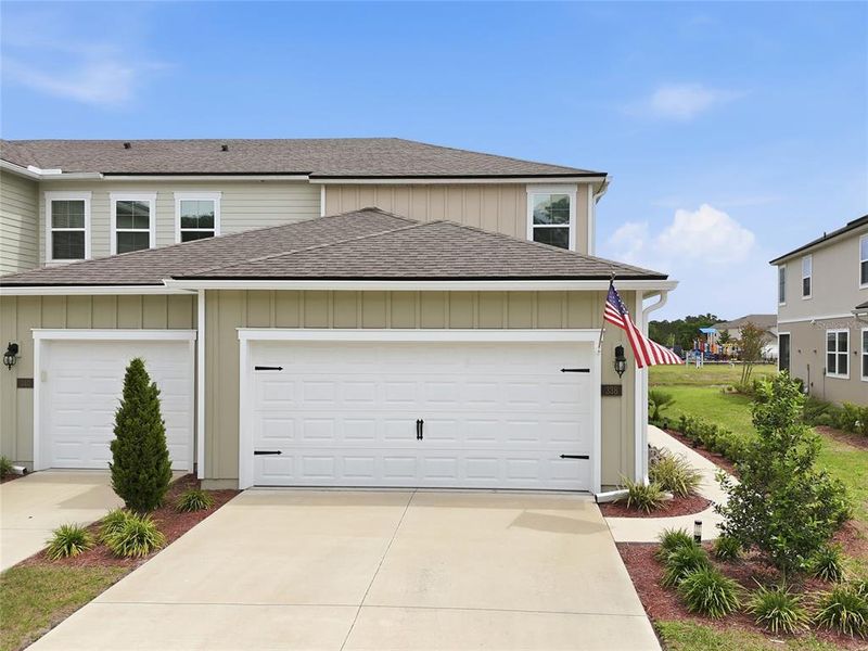 Front exterior of a new home in , Palm Coast, FL, highlighting curb appeal (Image 29).