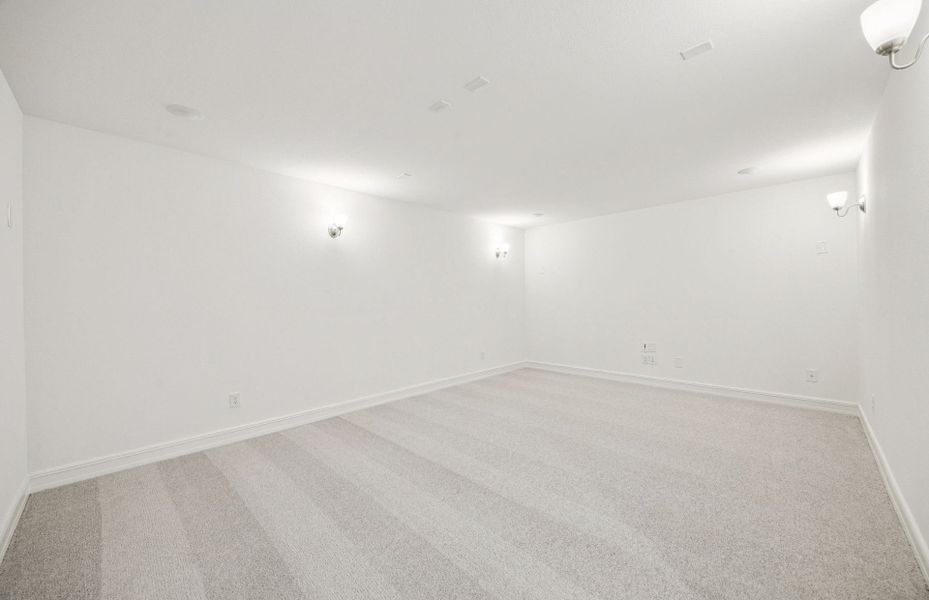 Deep media room perfect for movie nights and entertainment  *Real home pictured