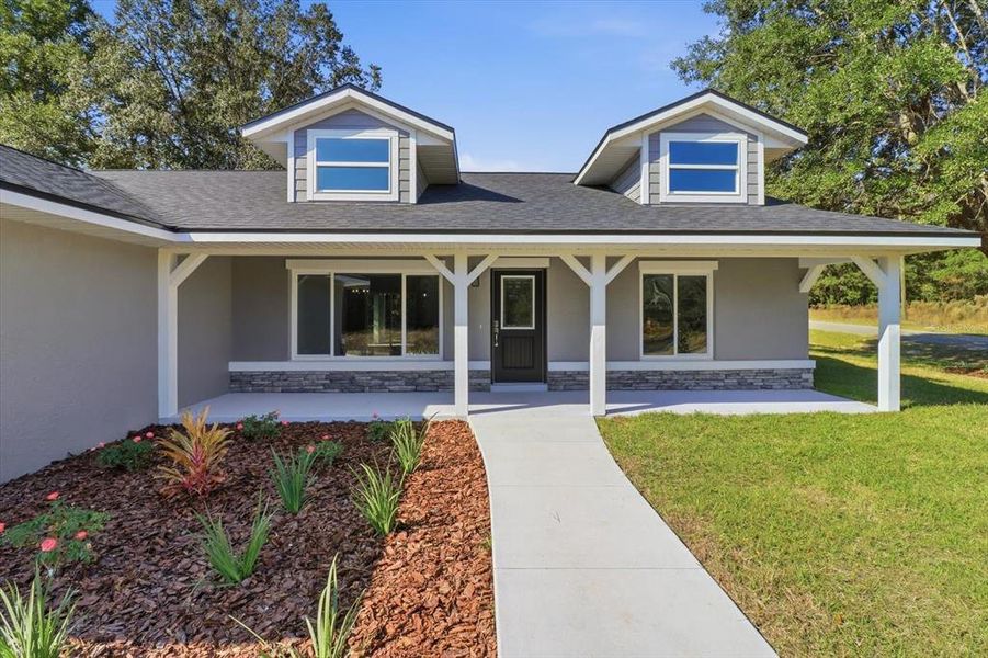 Front exterior of a new home in , Dunnellon, FL, highlighting curb appeal (Image 2).