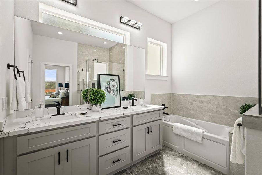 Pamper yourself in this spa-like bathroom! Luxurious fixtures, a deep soaking tub, and elegant tile work make this space a sanctuary. Treat yourself to a soothing bath after a long day