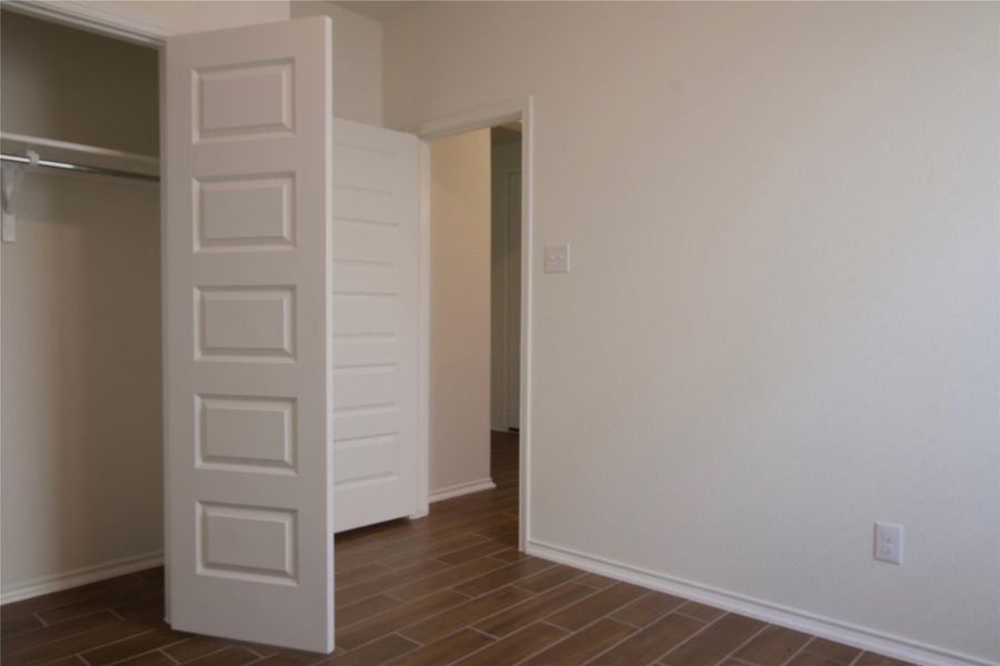 Wood-look tile flooring extends throughout this versatile, well-kept interior space.
