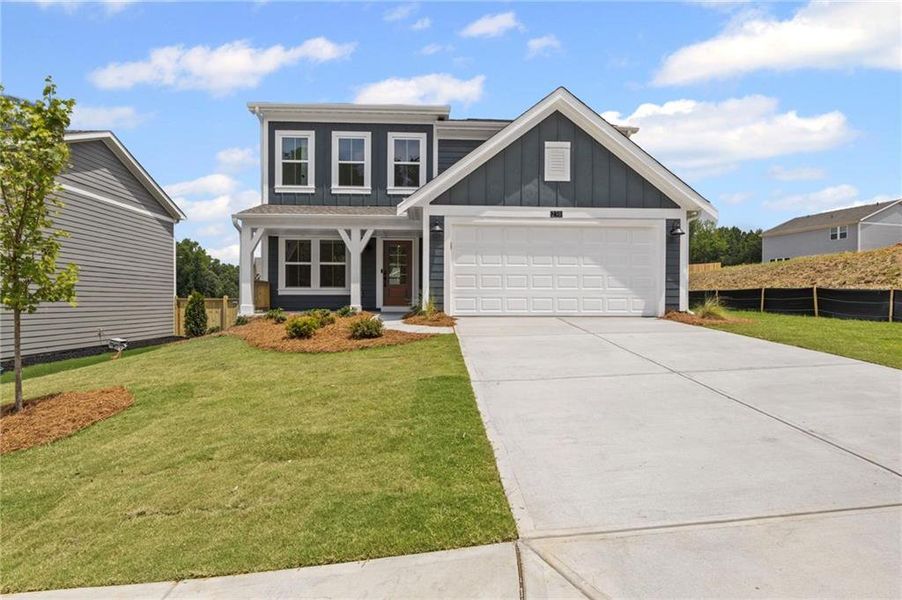Front exterior of a new home in Sage Woods, Dallas, GA, highlighting curb appeal (Image 20).