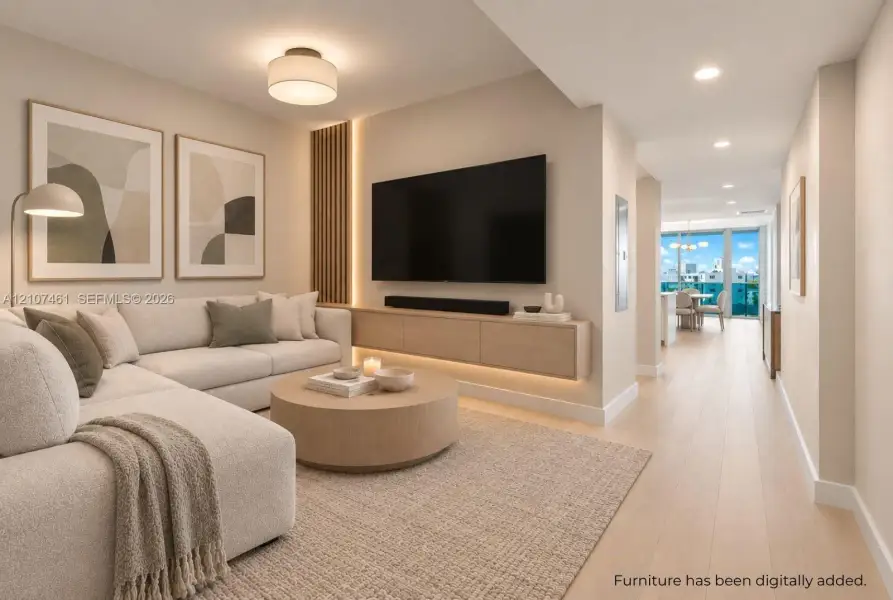 Living space featuring wood-finish flooring, floating wood-veneer cabinetry, integrated LED accent lighting, and vertical wood slat wall detailing Living space featuring wood-finish flooring, floating wood-veneer cabinetry, integrated LED accent lighting, and vertical wood slat wall detailing
