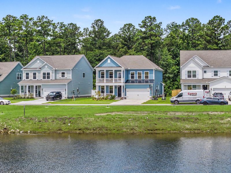 Front exterior of a new home in Tidewater at Lakes of Cane Bay, Summerville, SC, highlighting curb appeal (Image 24).