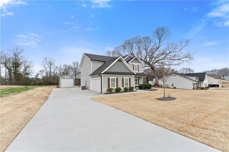 Front exterior of a new home in , Jefferson, GA, highlighting curb appeal (Image 22).