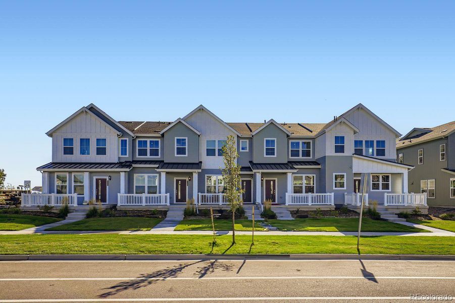 Front exterior of a new home in , Watkins, CO, highlighting curb appeal (Image 15).