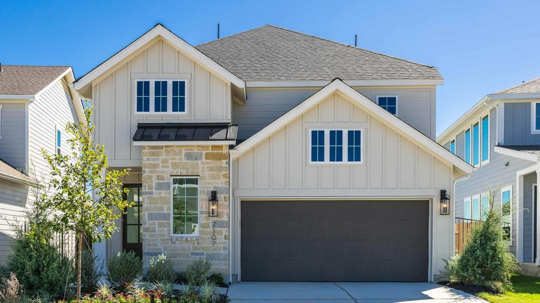 Front exterior of a new home in Easton Park 40', Austin, TX, highlighting curb appeal (Image 12). Front exterior of a new home in Easton Park 40', Austin, TX, highlighting curb appeal (Image 12).