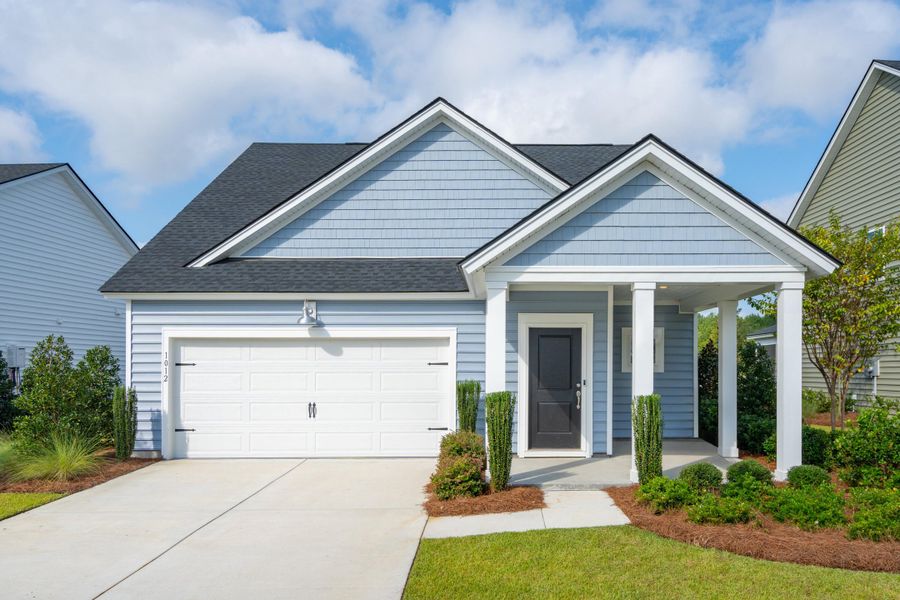 Front exterior of a new home in Sweetgrass at Summers Corner: Carolina Collection, Summerville, SC, highlighting curb appeal (Image 18). Front exterior of a new home in Sweetgrass at Summers Corner: Carolina Collection, Summerville, SC, highlighting curb appeal (Image 18).