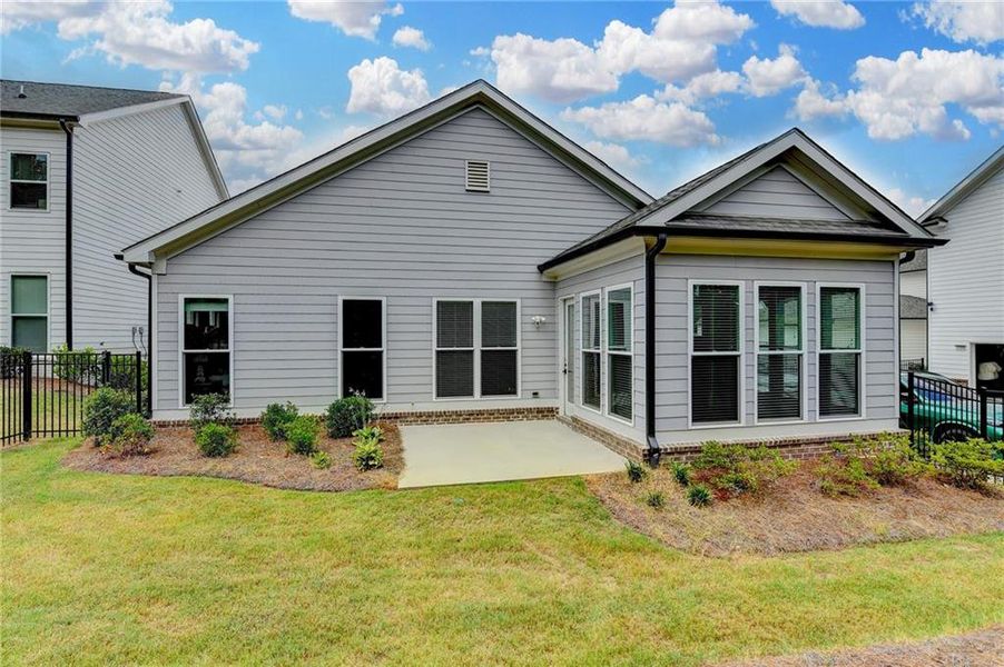 Exterior details and patio area of a home in Ellington Townhomes, Suwanee (Image 30).