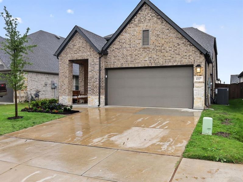Front exterior of a new home in , Royse City, TX, highlighting curb appeal (Image 22). Front exterior of a new home in , Royse City, TX, highlighting curb appeal (Image 22).