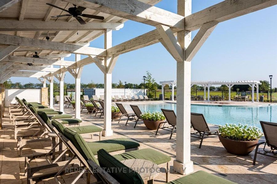 View of patio / terrace featuring a pergola, ceiling fan, and a community pool View of patio / terrace featuring a pergola, ceiling fan, and a community pool