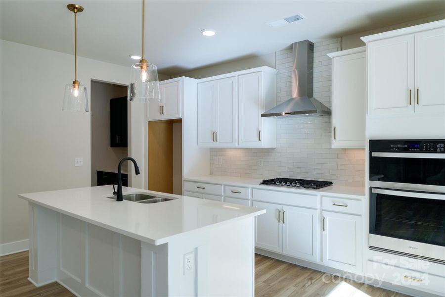 Large, trimmed kitchen island with seating