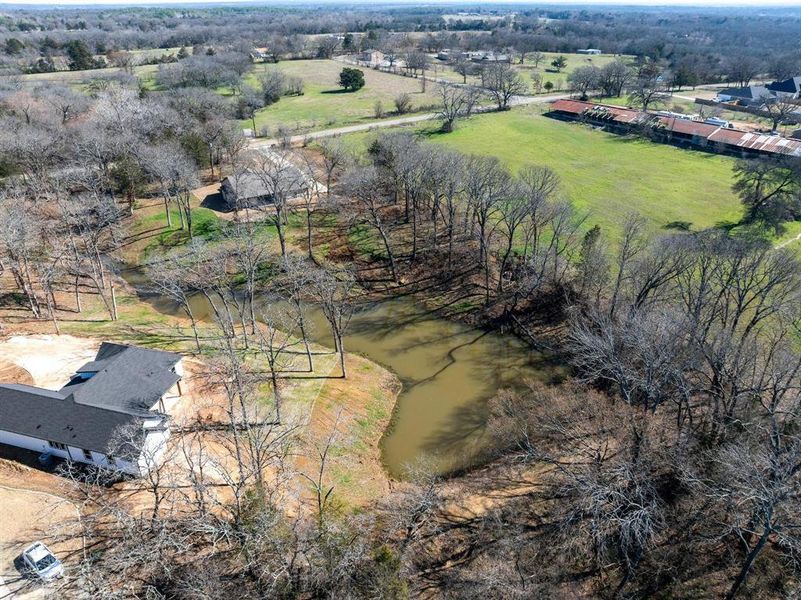 Drone / aerial view featuring a water view and a rural view