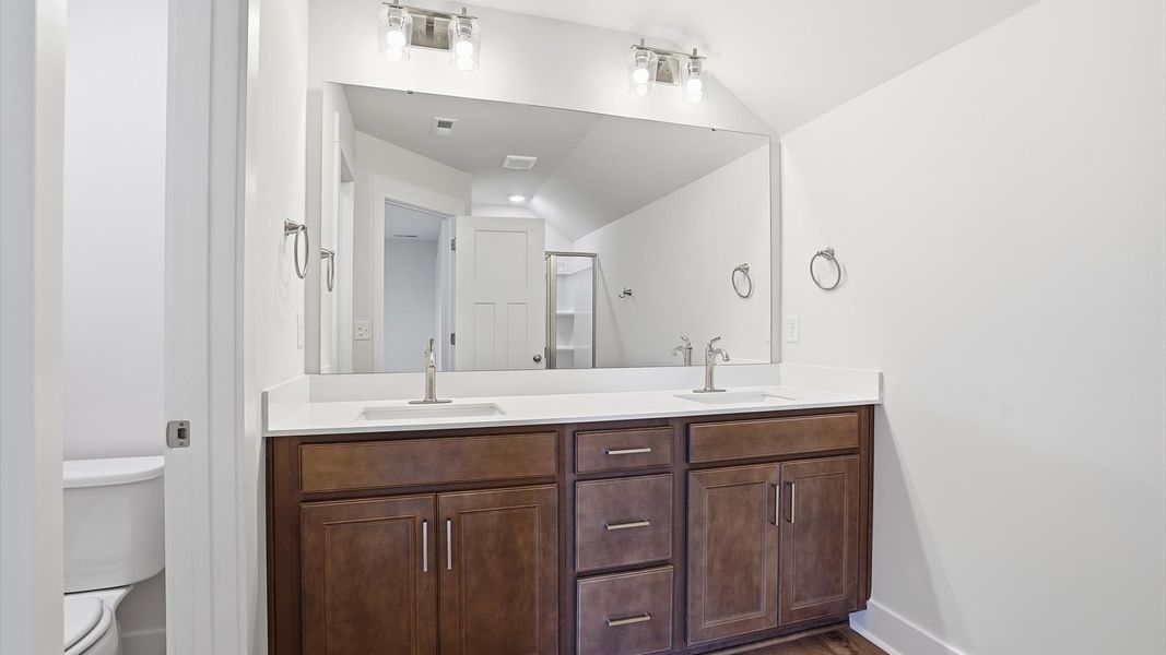 Top-notch bathroom with current fixtures, tasteful materials, and elevated charm at Benjamin's Grove Top-notch bathroom with current fixtures, tasteful materials, and elevated charm at Benjamin's Grove