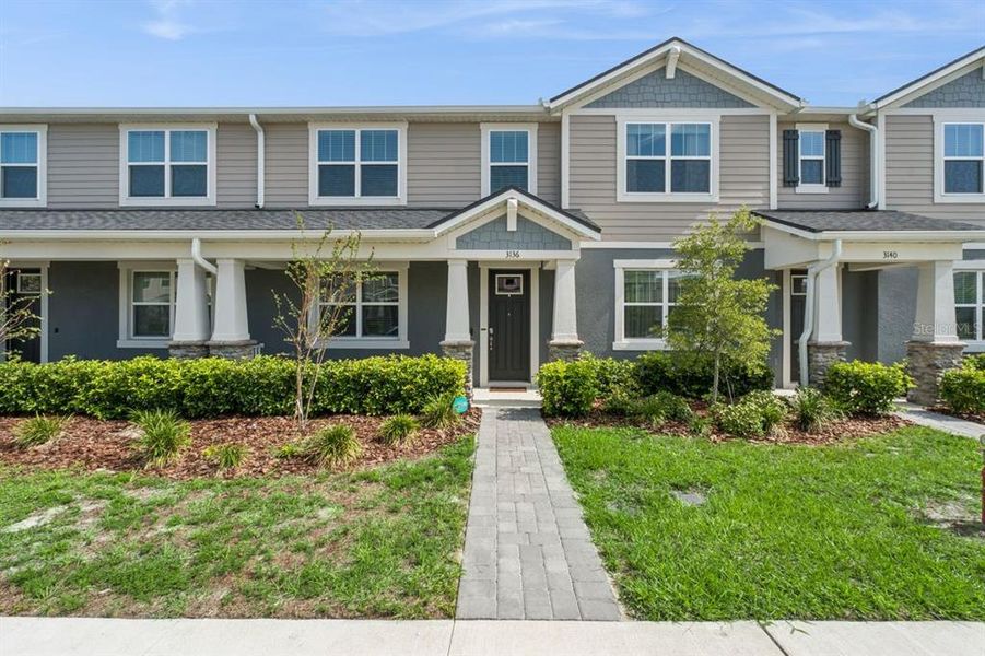 Front exterior of a new home in , Apopka, FL, highlighting curb appeal (Image 23). Front exterior of a new home in , Apopka, FL, highlighting curb appeal (Image 23).