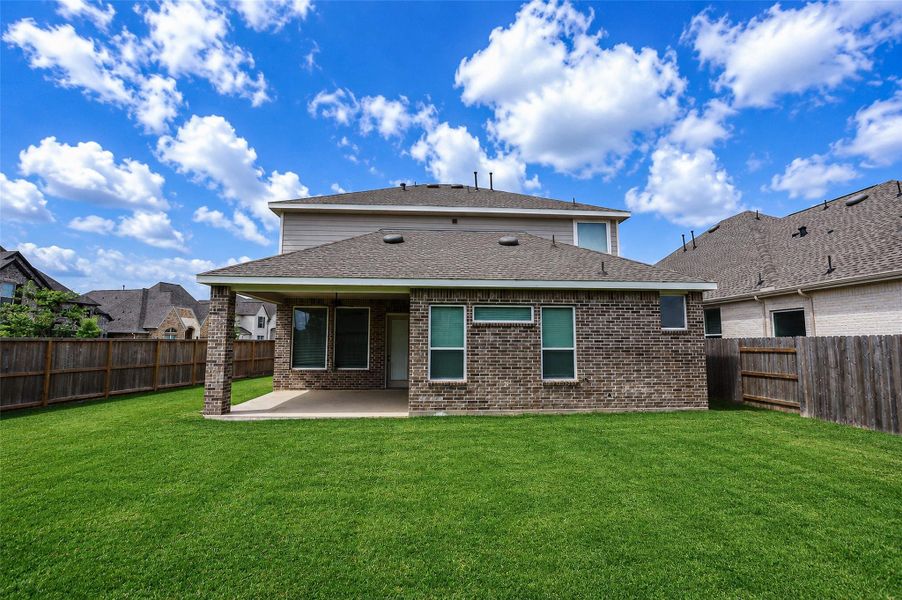 Exterior details and patio area of a home in , Katy (Image 25).