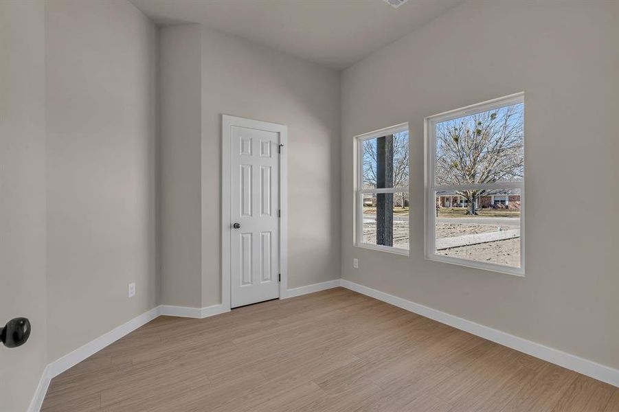 Unfurnished room with light wood-type flooring