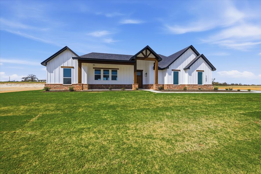Front exterior of a new home in Zion Valley, Poolville, TX, highlighting curb appeal (Image 21).
