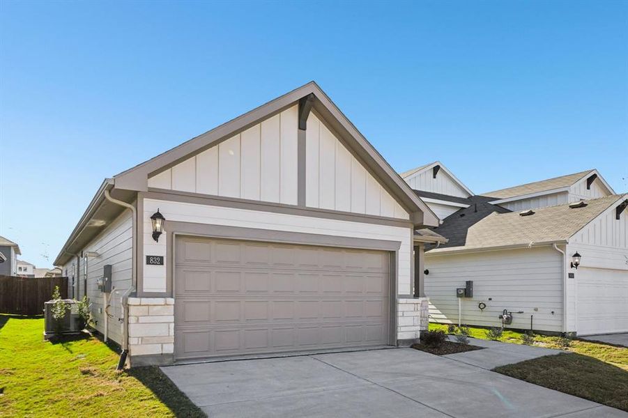 Front exterior of a new home in Trails of Lavon - Spring Series, Lavon, TX, highlighting curb appeal (Image 25).