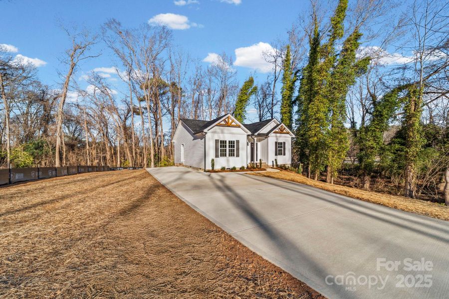 Front exterior of a new home in , Monroe, NC, highlighting curb appeal (Image 15).