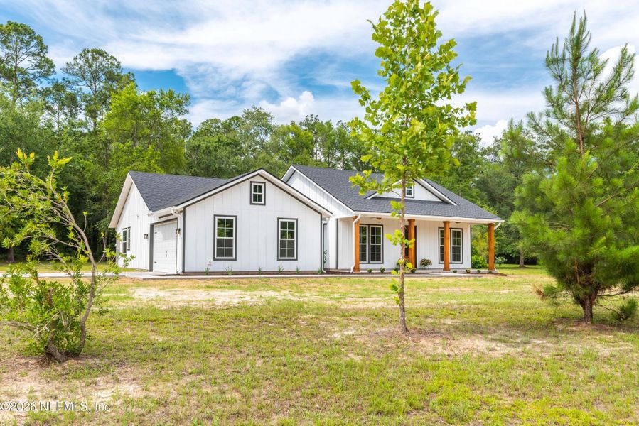 Front exterior of a new home in , Glen St. Mary, FL, highlighting curb appeal (Image 21).