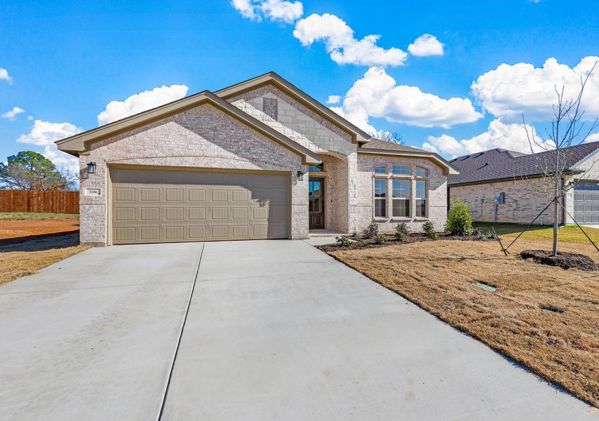 Representative exterior photo of a completed home built from the Sherwood by Cheldan Homes in Sunset Ridge, Keene, TX (Image 33). Representative exterior photo of a completed home built from the Sherwood by Cheldan Homes in Sunset Ridge, Keene, TX (Image 33).