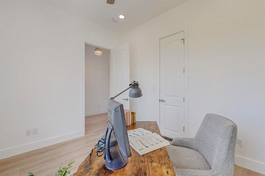 Sitting room with light hardwood / wood-style floors