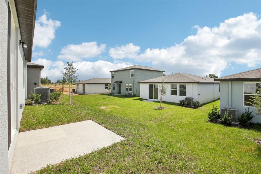 Front exterior of a new home in Benton Hills - Classic Series, Brooksville, FL, highlighting curb appeal (Image 18). Front exterior of a new home in Benton Hills - Classic Series, Brooksville, FL, highlighting curb appeal (Image 18).