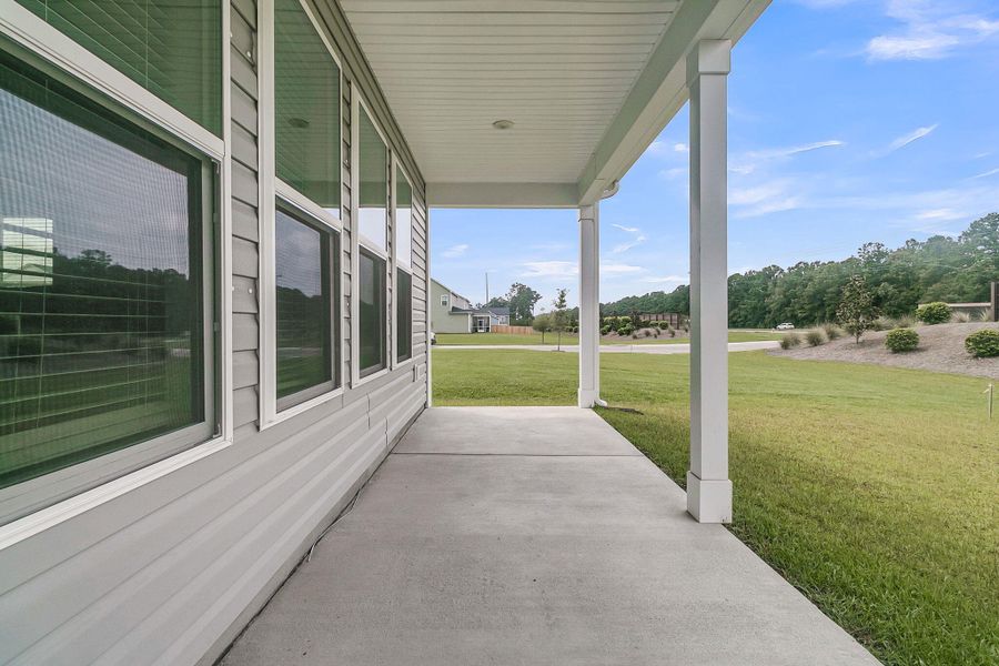 Front exterior of a new home in The Groves of Berkeley, Moncks Corner, SC, highlighting curb appeal (Image 18).