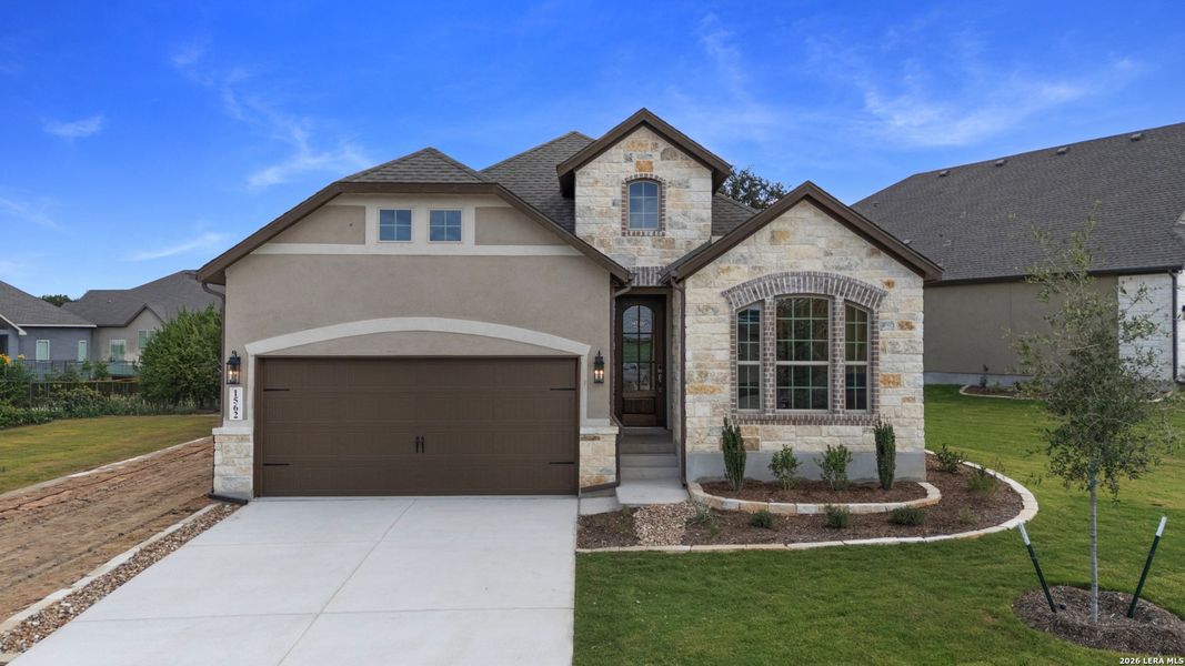 Front exterior of a new home in Willis Ranch, San Antonio, TX, highlighting curb appeal (Image 19).