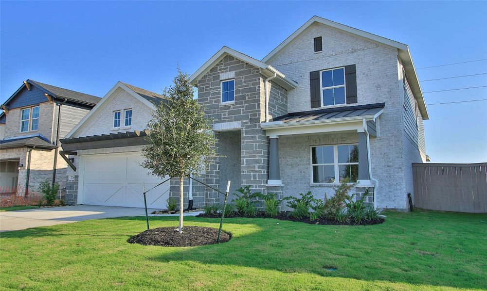 Front exterior of a new home in Creekhaven, Arcola, TX, highlighting curb appeal (Image 2). Front exterior of a new home in Creekhaven, Arcola, TX, highlighting curb appeal (Image 2).