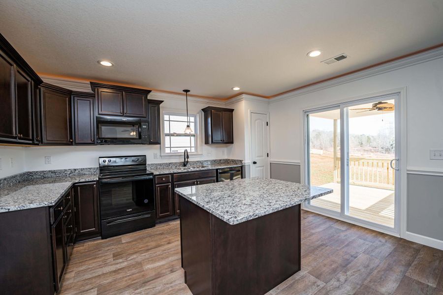 Representative furnished interior of a home built from the Sumter by Enchanted Homes in Lonesome Dove, San Antonio (Image 43).