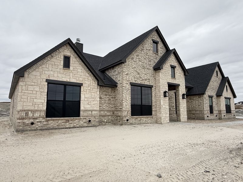 Front exterior of a new home in Aledo Heights - Aledo ISD, Annetta South, TX, highlighting curb appeal (Image 11).