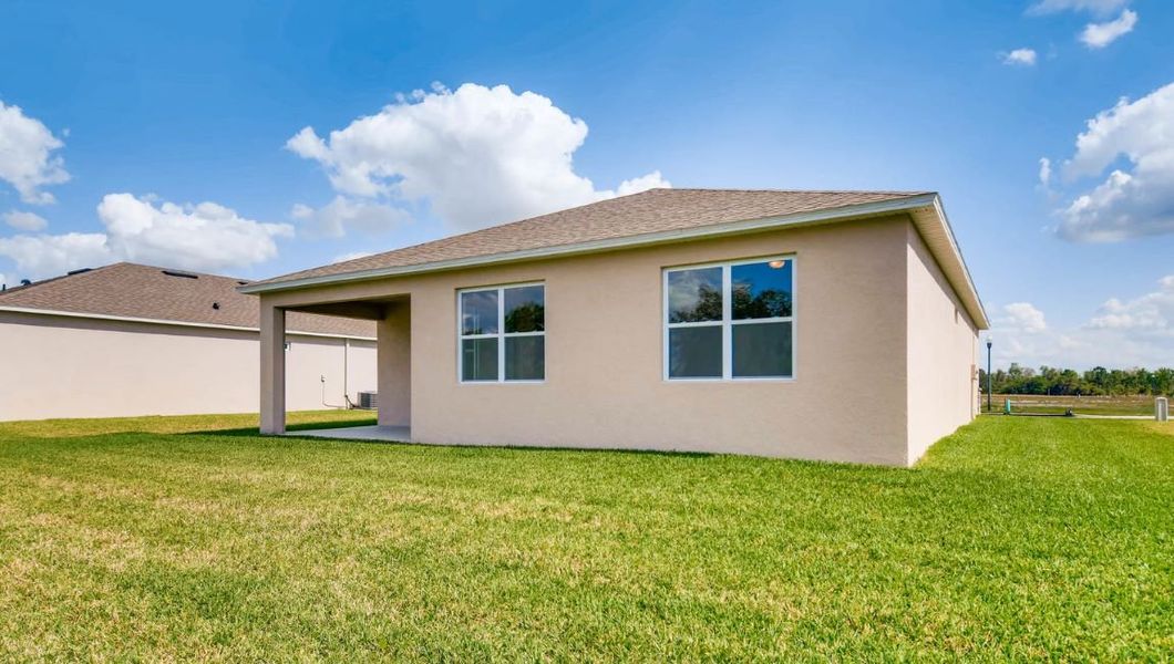 Front exterior of a home in the Preserves at Lakeside Landings community, located in Winter Haven, FL (Image 14).