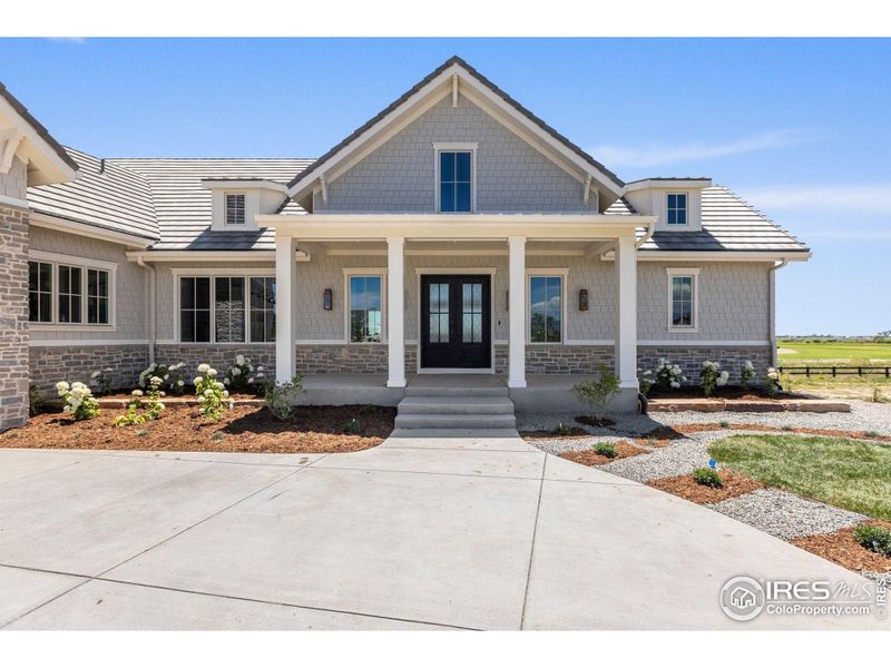 Front exterior of a new home in , Berthoud, CO, highlighting curb appeal (Image 21).