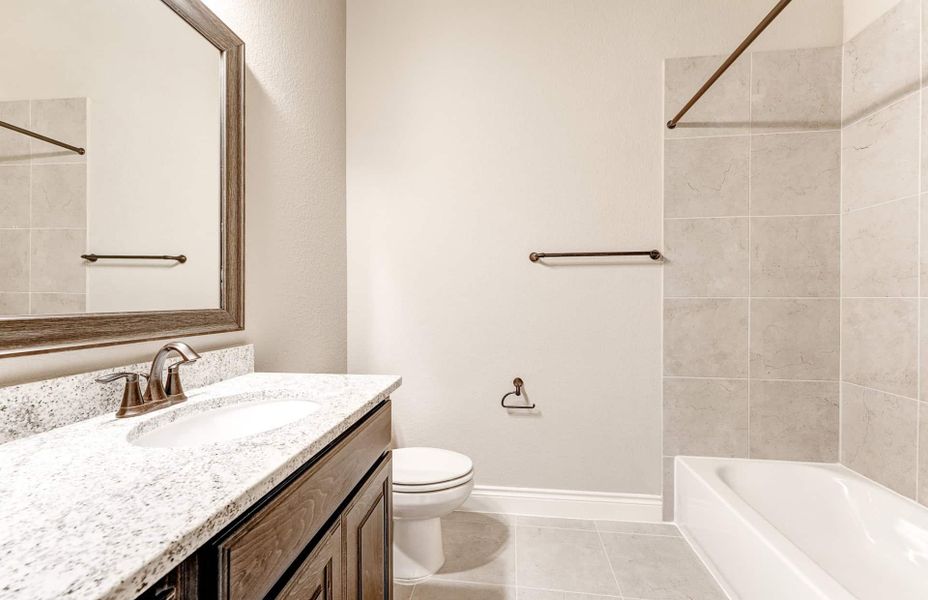 Representative furnished interior of a home built from the 4590 by Ravenna Homes in Artavia 70′, Conroe (Image 7).