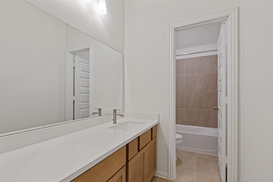 Furnished interior view inside a new home in The Woodlands Hills, Willis (Image 9).