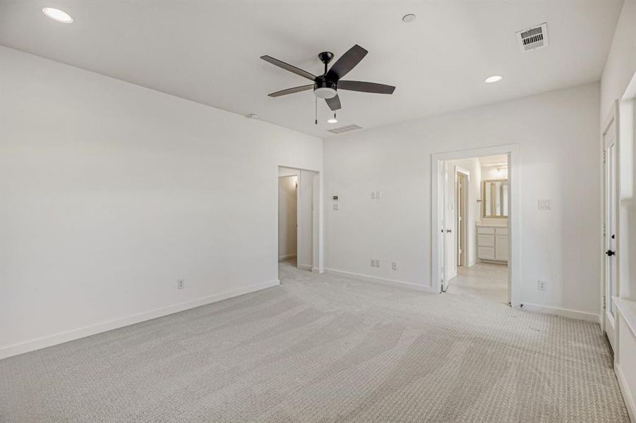 Unfurnished bedroom with recessed lighting, light carpet, a ceiling fan, and connected bathroom
