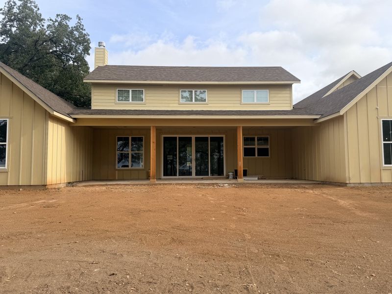 Front exterior of a new home in Monarch Manor, Poolville, TX, highlighting curb appeal (Image 9).