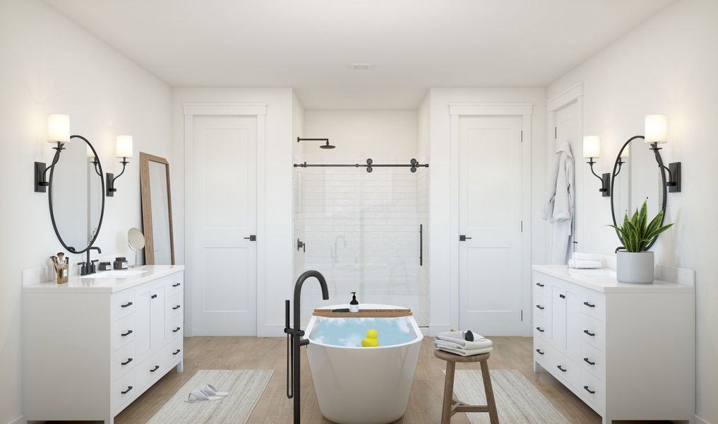 Primary bath with matte black fixtures and freestanding tub