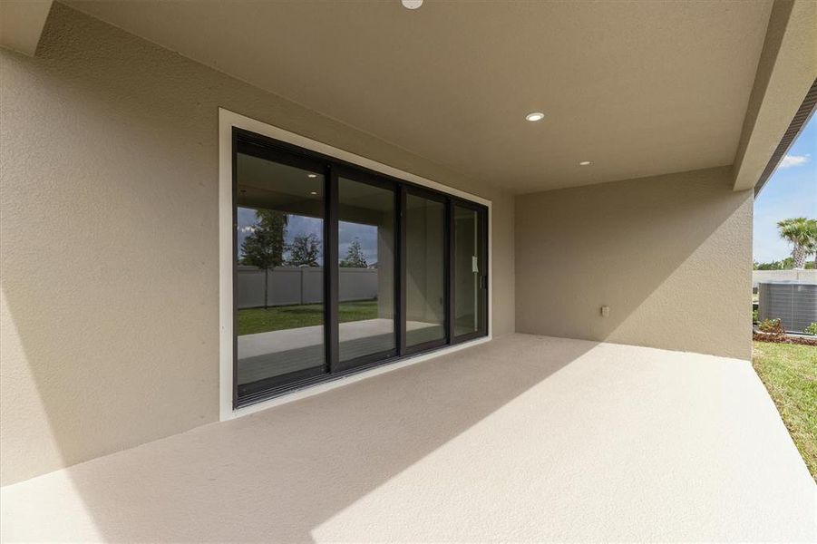 Exterior details and patio area of a home in Caldera, Spring Hill (Image 3).