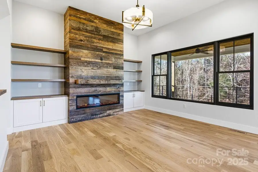 Light-flooded great room with elevated fixtures and gorgeous natural light