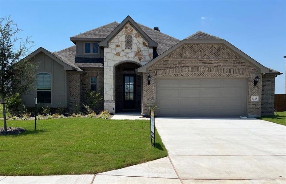 Front exterior of a new home in Bull Hide Estates, Hewitt, TX, highlighting curb appeal (Image 1).