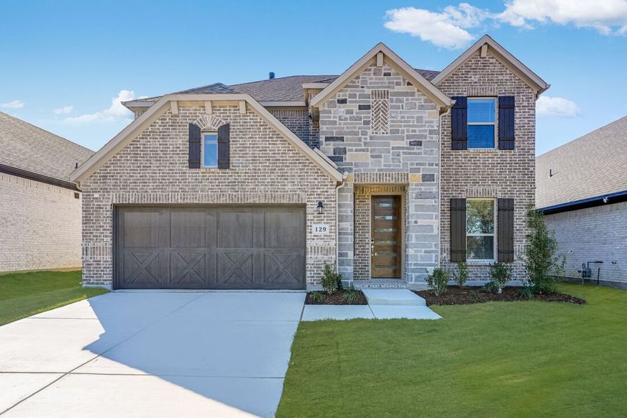 Front exterior of a new home in South Oak 50s, Oak Point, TX, highlighting curb appeal (Image 1).