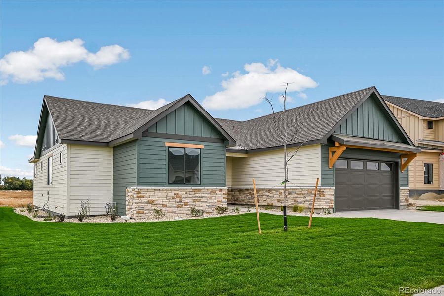 Front exterior of a new home in , Fort Morgan, CO, highlighting curb appeal (Image 2). Front exterior of a new home in , Fort Morgan, CO, highlighting curb appeal (Image 2).