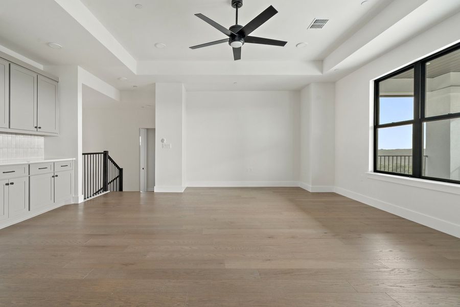Spacious, unfurnished interior of a new home in Milky Way at River Place, Austin (Image 30).