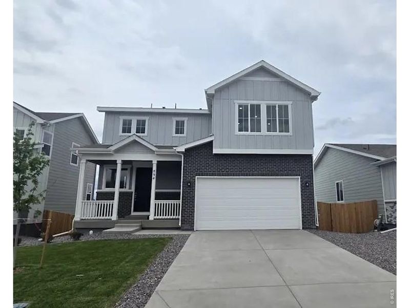 Front exterior of a new home in The Overlook at Johnstown Farms, Johnstown, CO, highlighting curb appeal (Image 1). Front exterior of a new home in The Overlook at Johnstown Farms, Johnstown, CO, highlighting curb appeal (Image 1).