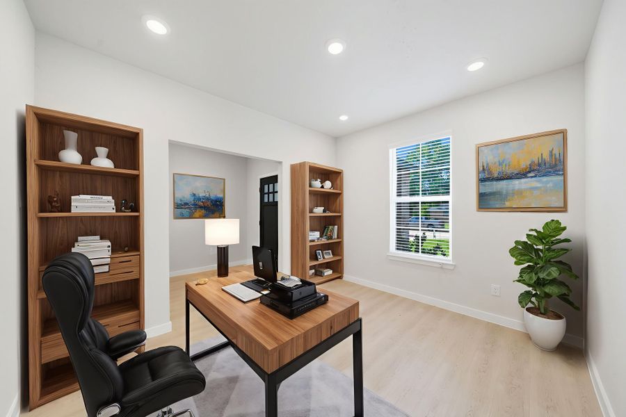 A room with a desk and a chair.